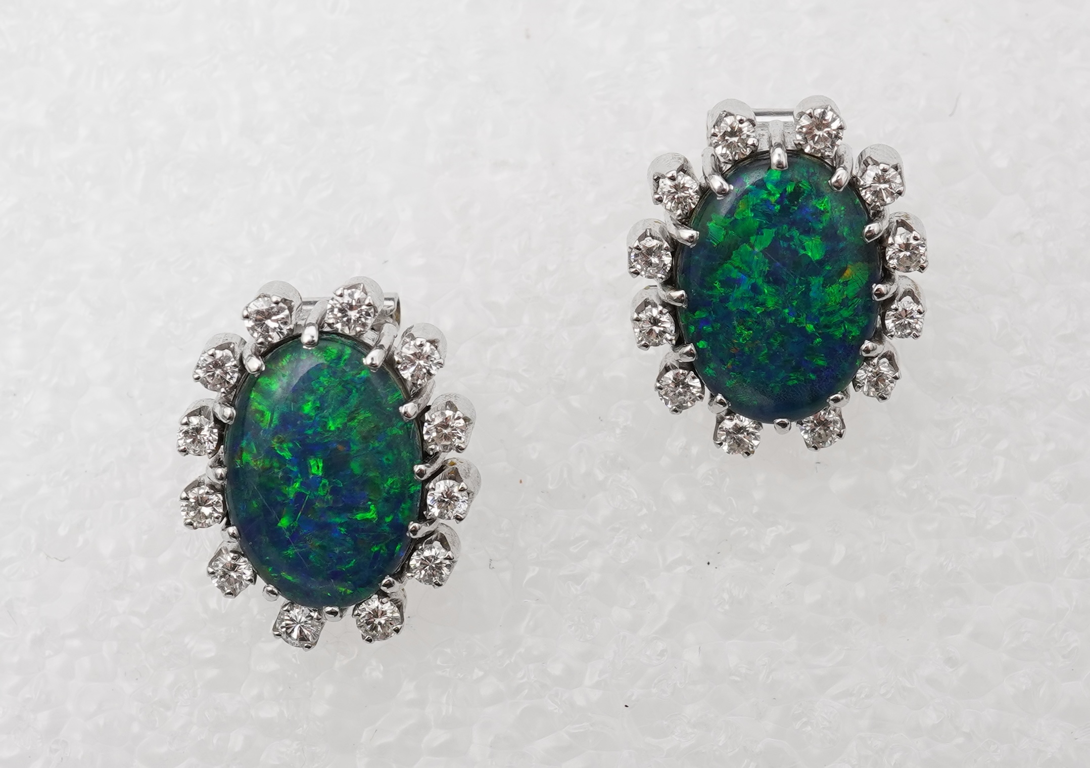 A pair of opal triplet and diamond earrings